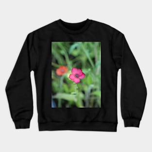 Dark pink flower with a nice bokeh Crewneck Sweatshirt